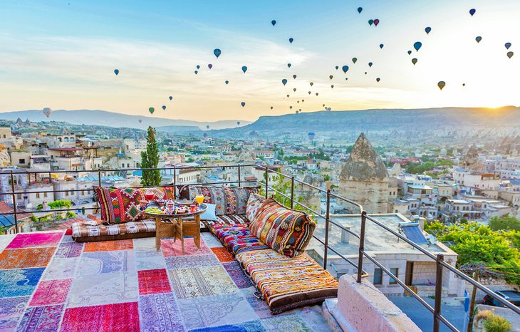 Balloons seen from a Göreme hotel roof terrace