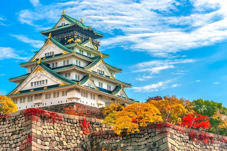 Osaka Castle with autumn leaves
