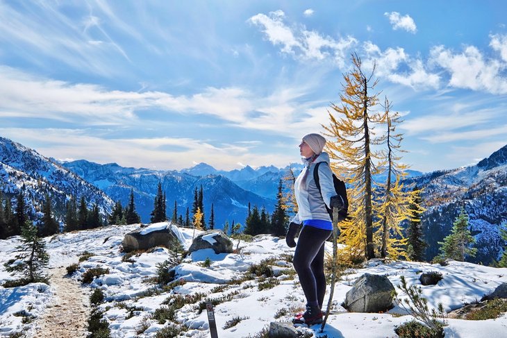 Hiker in the winter at Mount Rainier National Park near Seattle