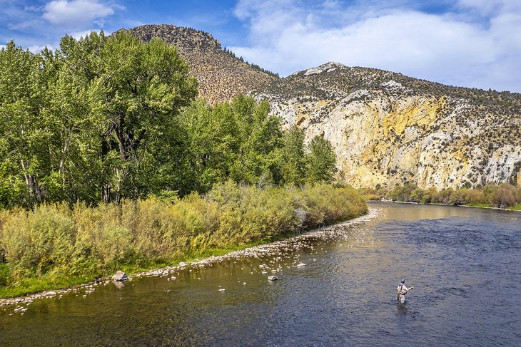 Fly fisherman on the Big Hole River near Melrose, Montana