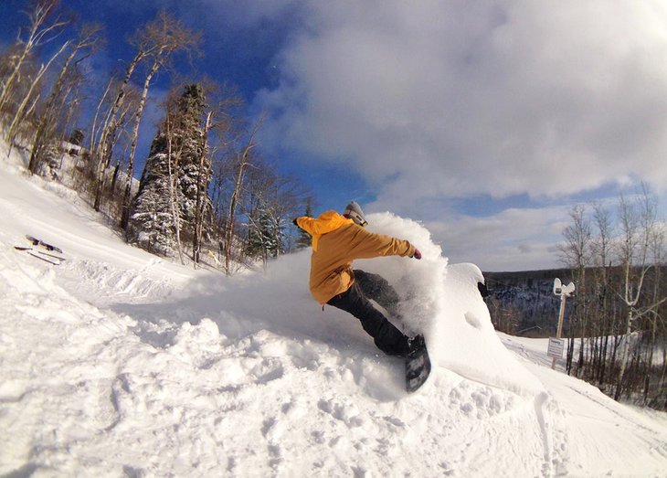 Snowboarder ripping the Loch Lomond Ski Area