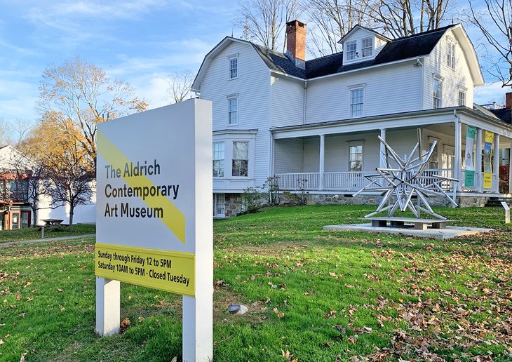 The old and new Aldrich Contemporary Art Museum buildings highlighted by a Frank Stella Star