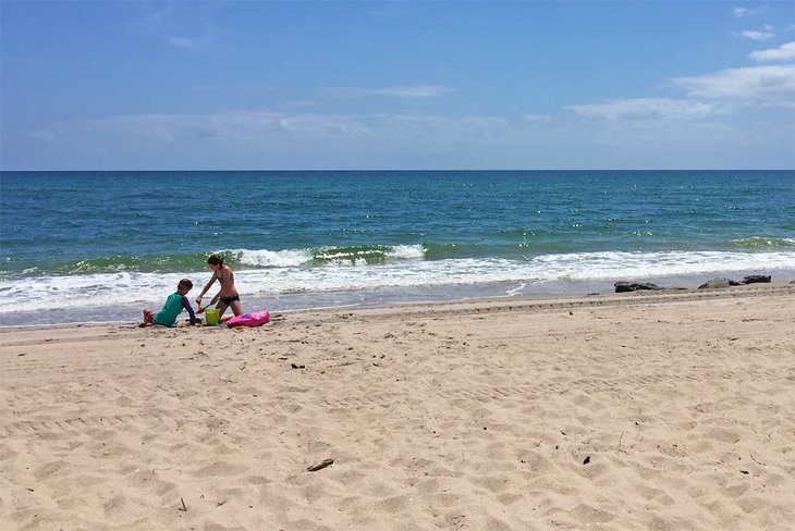 The writer's children build a sandcastle at Oceanfront Park