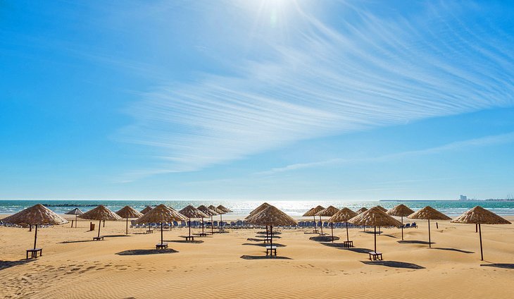 Umbrellas on an empty beach in Agadir, Morocco