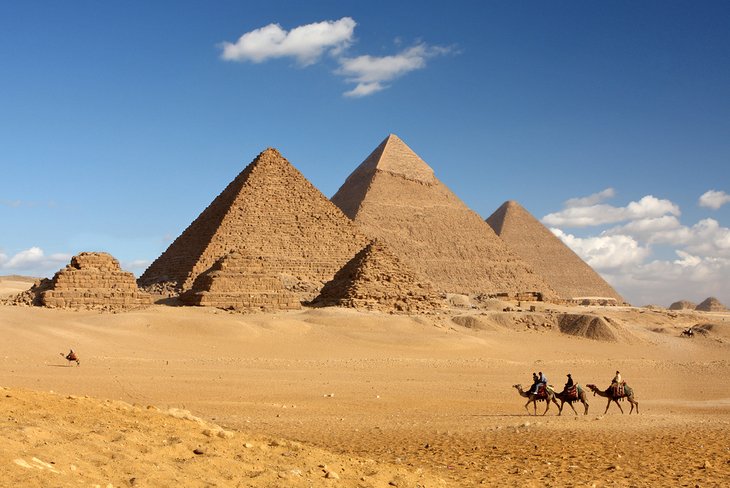 Riding camels at the pyramids of Giza
