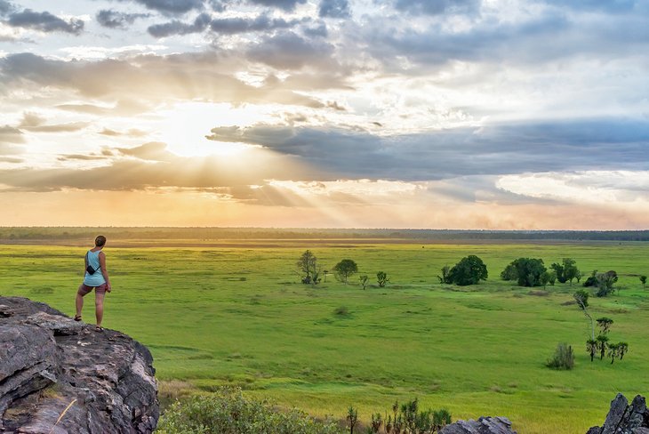 Hiker at Nadab lookout during sunset, Ubirr Walk, Kakadu National Park