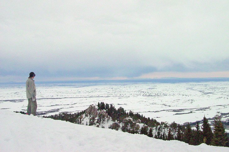 Snowboarder enjoying the view from Red Lodge Mountain