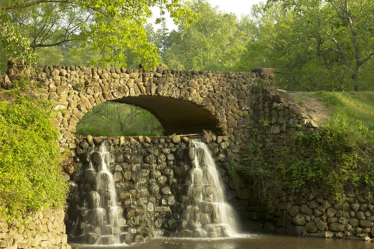 Stone bridge and waterfall in Reynolda Gardens in Winston-Salem