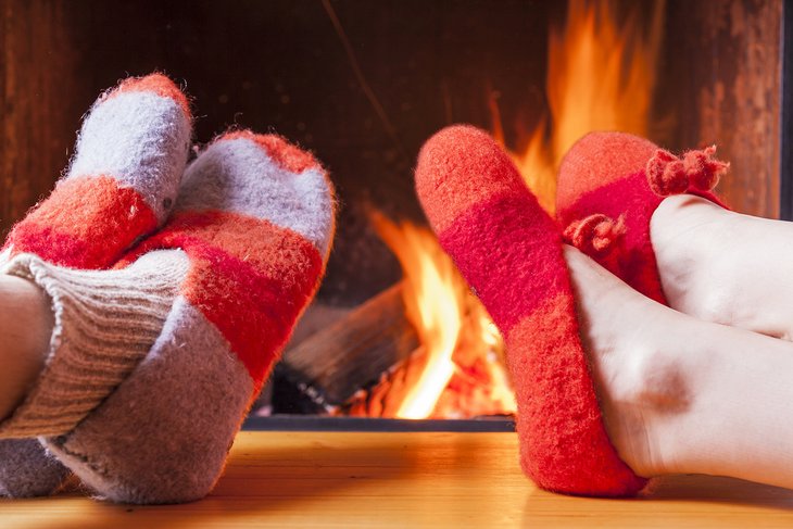 Couple enjoying a cozy fire