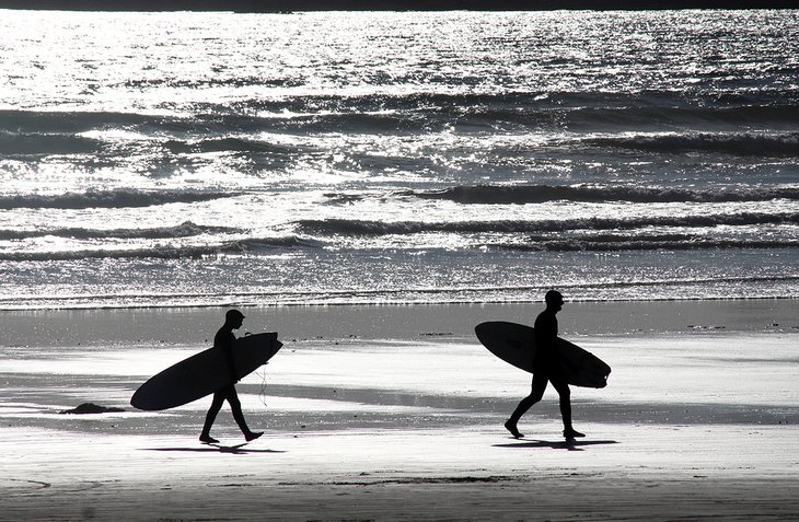 Surfers in Tofino, British Columbia