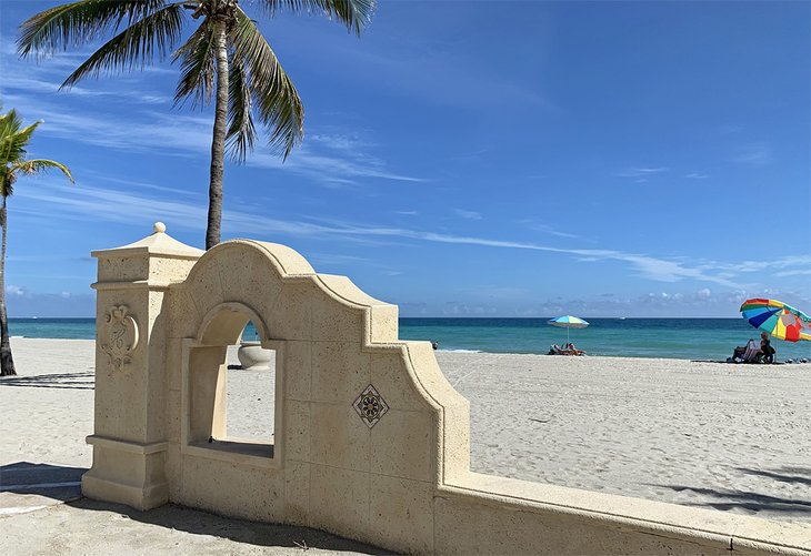 Soft golden sand and palm trees at Hollywood Beach