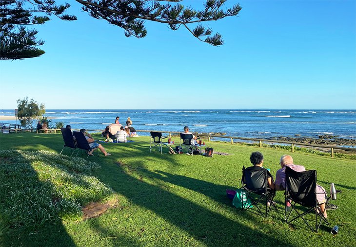 Couples enjoying a picnic overlooking Bulcock Beach