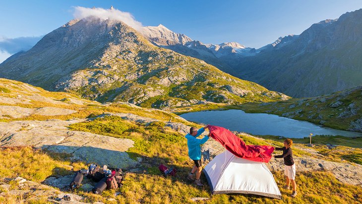 Setting up a tent in the mountains