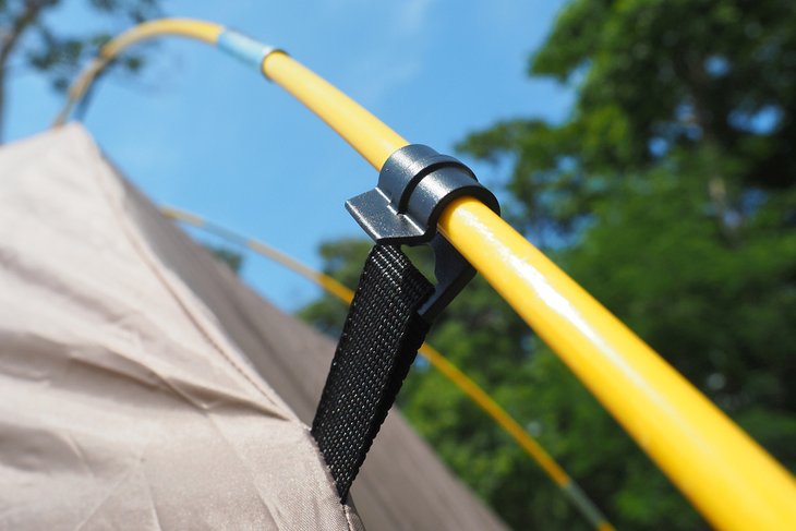 Tent poles attached to tent structure