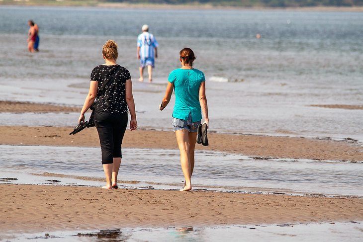 Taking a relaxing stroll along Parlee Beach