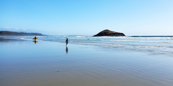 Surfer and child on Long Beach, Tofino