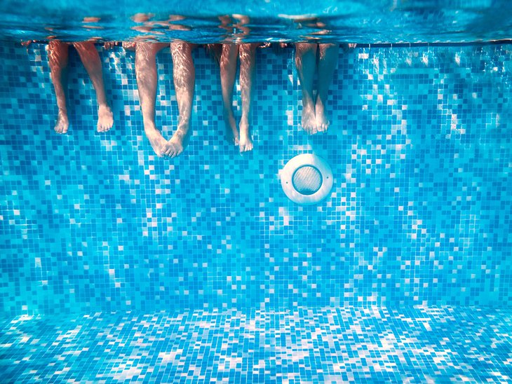 Kids feet in a pool