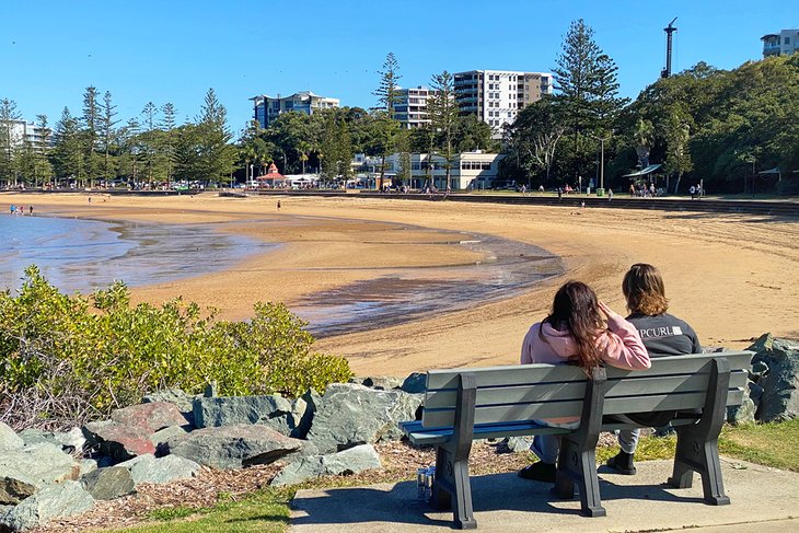 Couple enjoying a view of the beach at Redcliffe