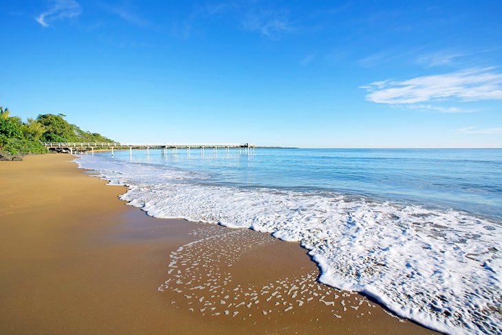 Hervey Bay's peaceful beaches are sheltered by K'Gari (Fraser Island).