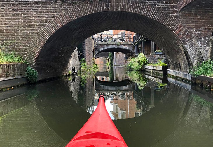 Kayaking along a canal in Utrecht