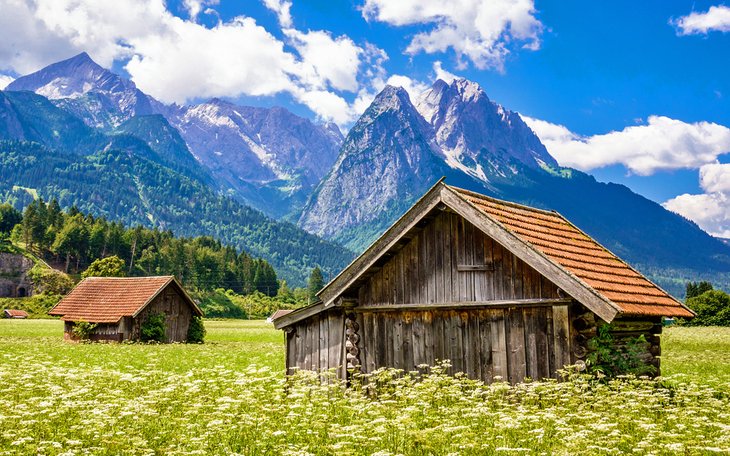 Alpine huts in front of the Zugspitze