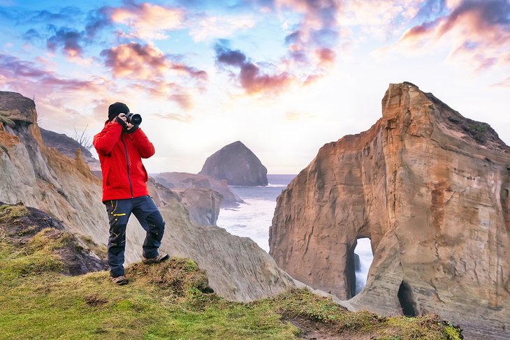 Photographer capturing the beauty of Cape Kiwanda