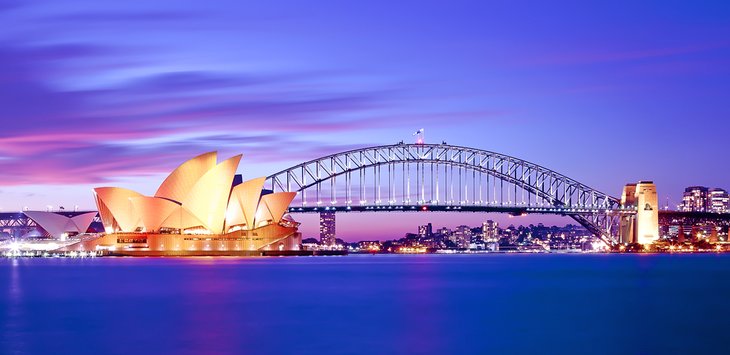 Sydney Opera House and harbor at dusk