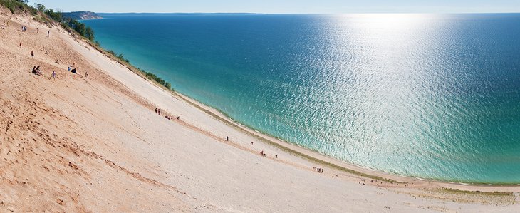 People climbing on the dunes at Sleeping Bearn Dunes National Lakeshore