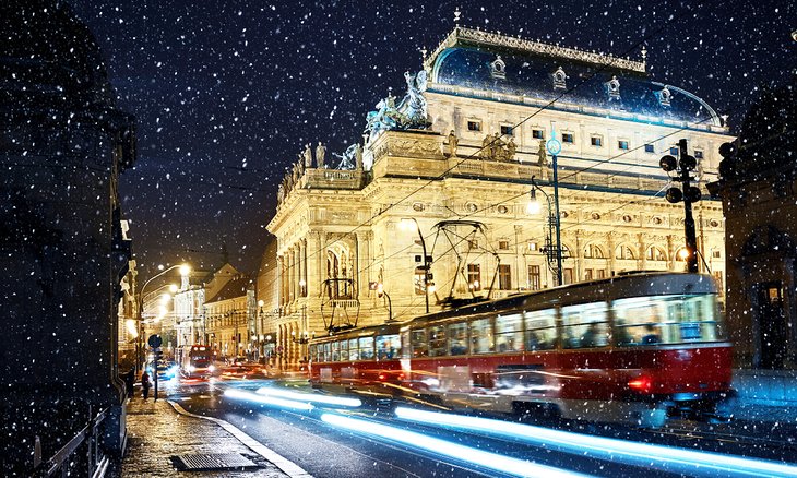 Tram riding past the National Theater in Prague