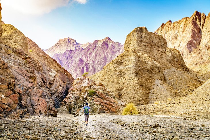 Hiker in the Hajar Mountains near Hatta