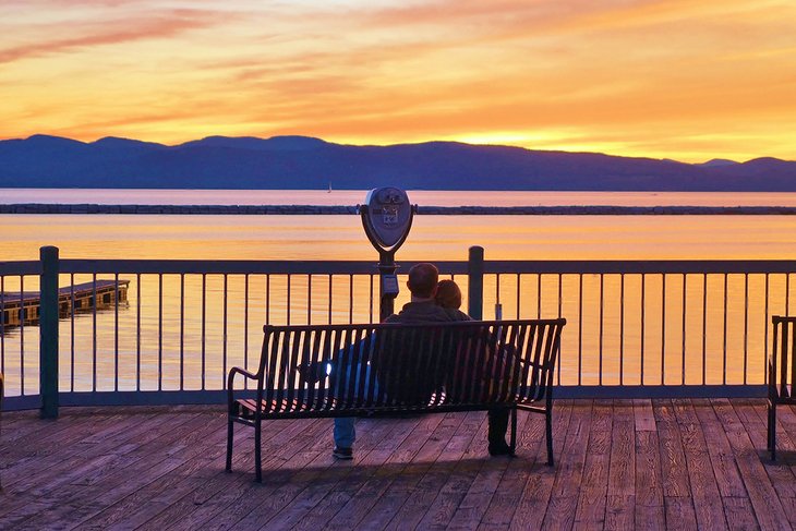 Couple enjoying a sunset over Lake Champlain at Burlington