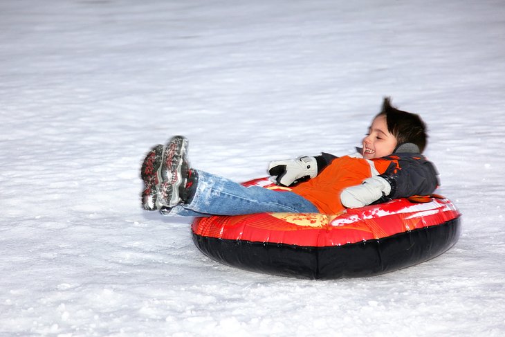 Boy tubing in Maine