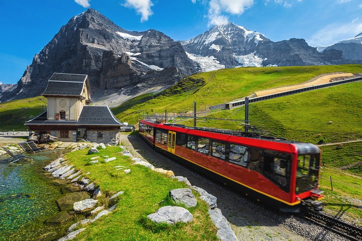 Cogwheel red tourist train coming down the Jungfraujoch