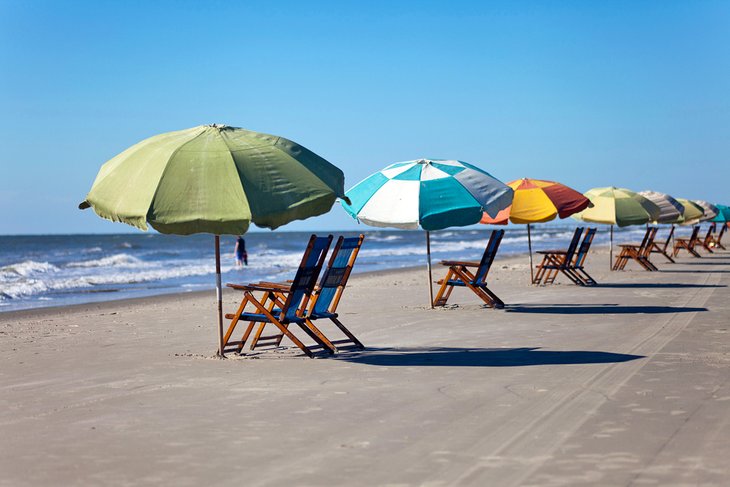 Sun umbrellas and chairs on the beach in Galveston, Texas