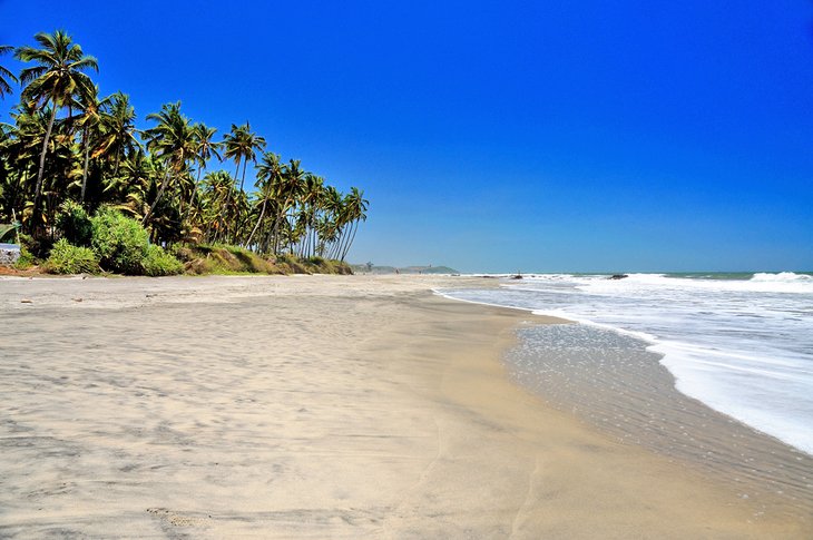 Palm-lined Ashwem Beach
