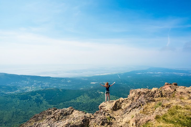 Hiker on top of Flattop Mountain