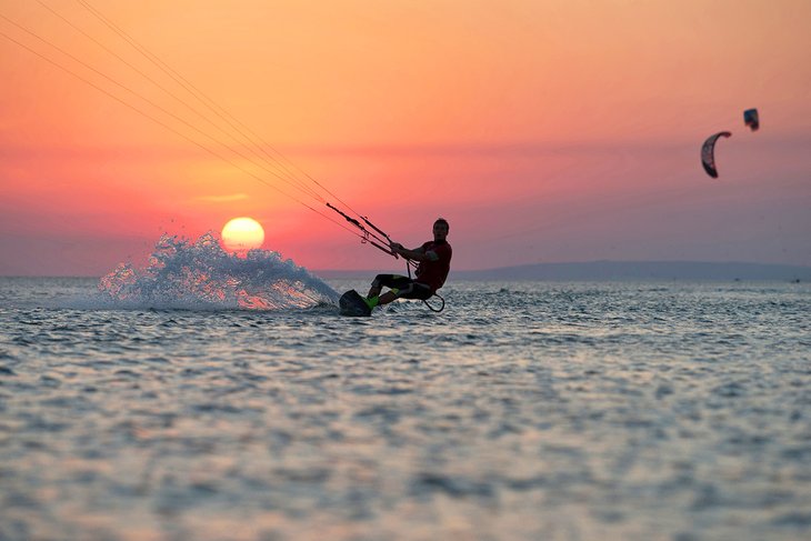 Kiteboarding at sunset