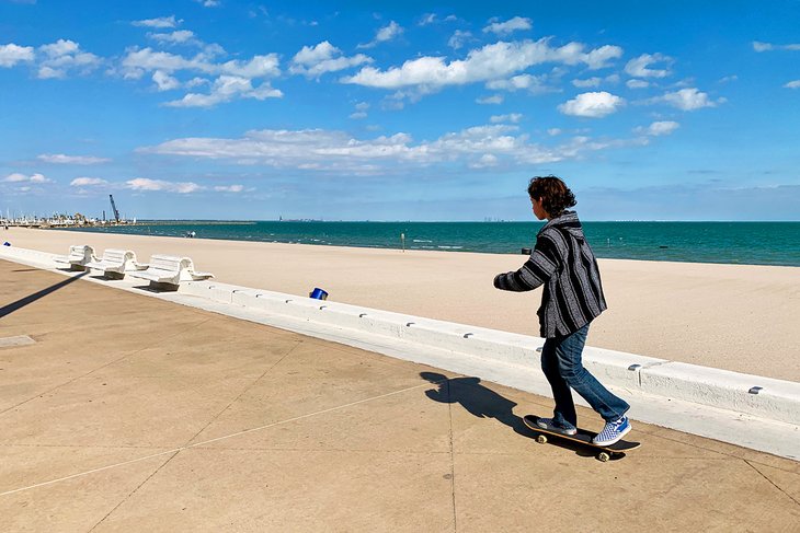 Skateboarding along McGee Beach