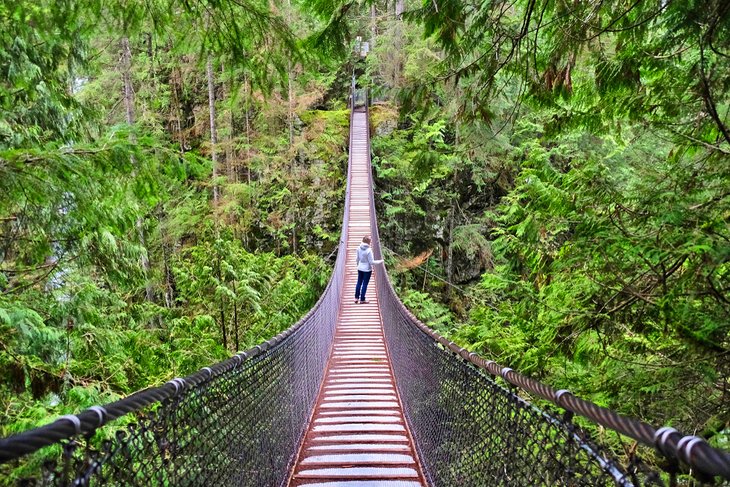 Woman hiking over the Lynn Canyon Suspension Bridge