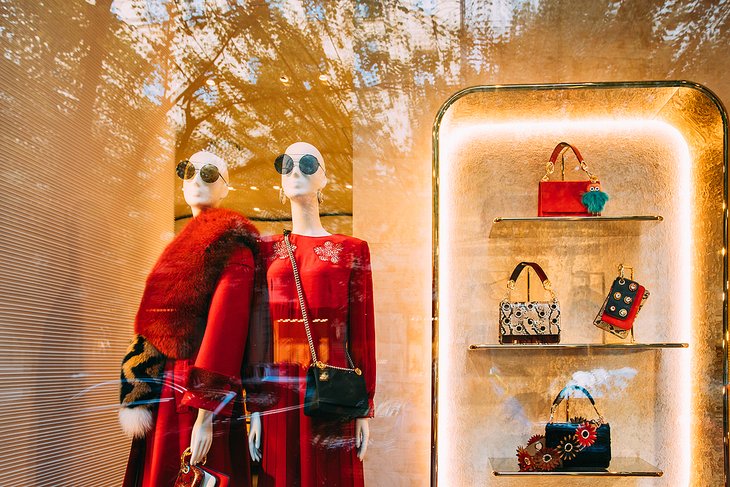 Group of tourist women in front of Louis Vuitton store on Parizska