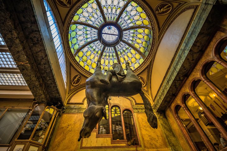 Statue of Saint Wenceslas riding an upside-down horse in Lucerna palace passage