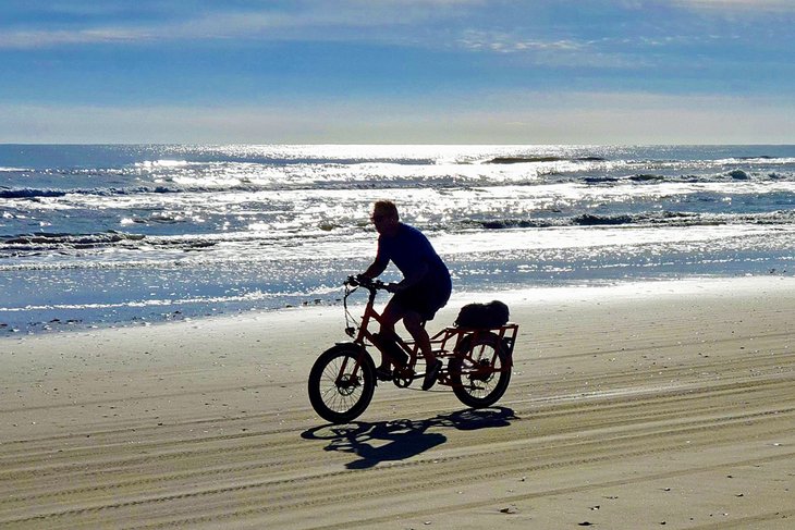 Cyclist on South Padre Island City Beach
