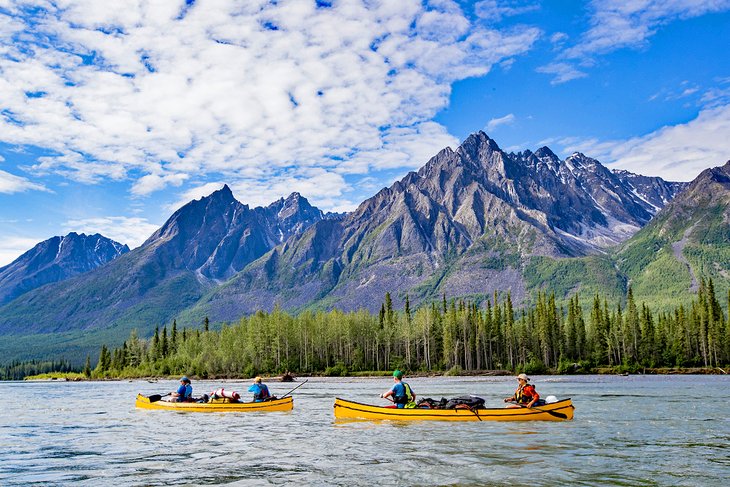 Canoes paddling on the Nahanni River in the Northwest Territories