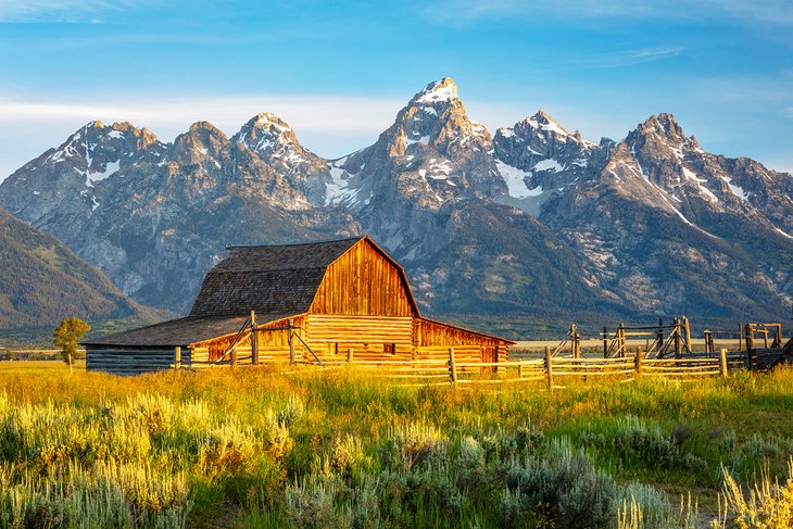 Sunrise at Moulton Barn along Mormon Row with the Grand Teton Mountains in the background