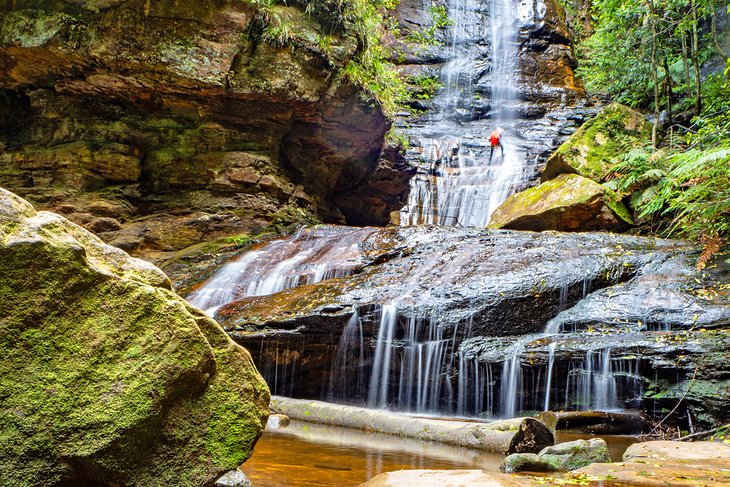 Abseiling down a waterfall in the Blue Mountains, Australia