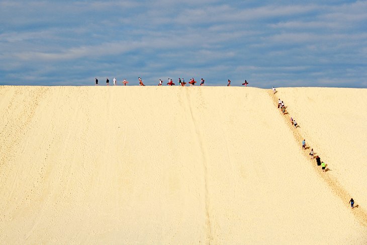 Surfing the sand dunes on Moreton Island