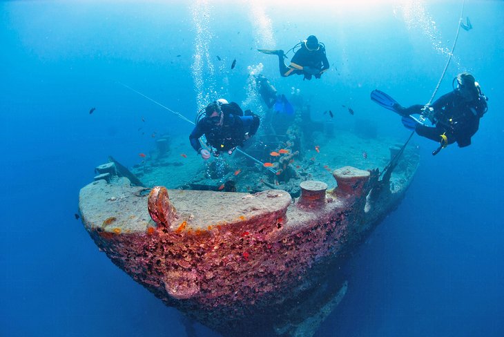 Divers exploring the SS Thistlegorm shipwreck