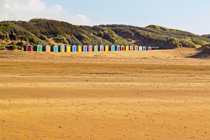 Colorful beach huts at Saunton Sands