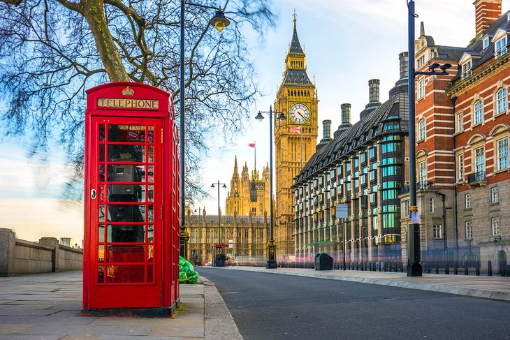 Iconic British red telephone box with Big Ben in the background