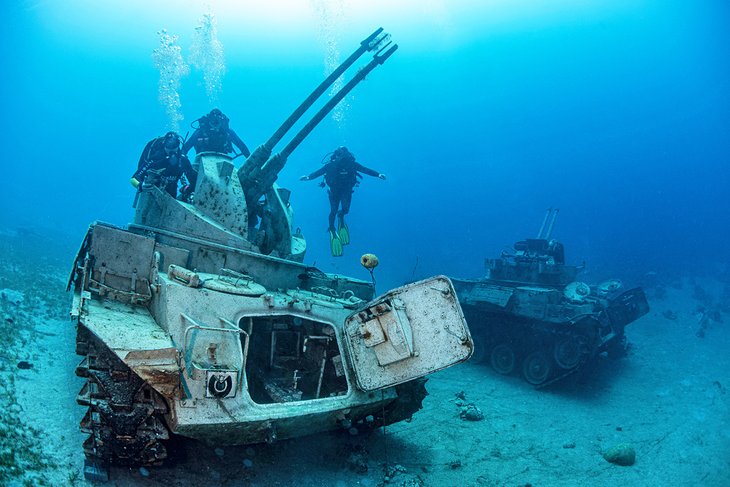 Divers above tanks in Aqaba